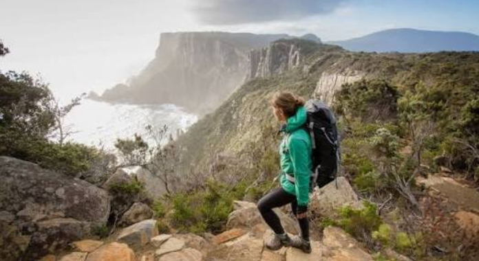 Trekker on a limestone trail in the Supramonte, Sardinia
